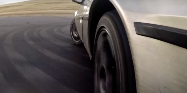 closeup of a DeLorean's wheels while drifting